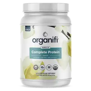 A supplement container of organifi complete protein meal replacement powder.