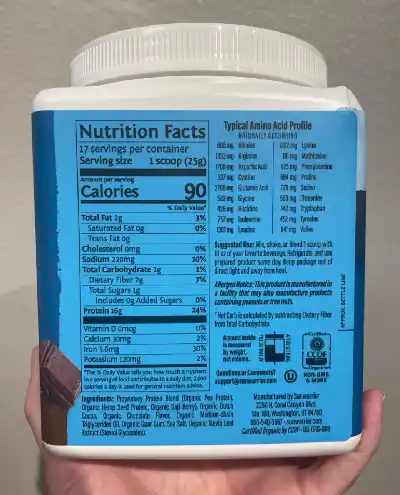 a jar of the Sunwarrior protein powder with the nutrition label visible.