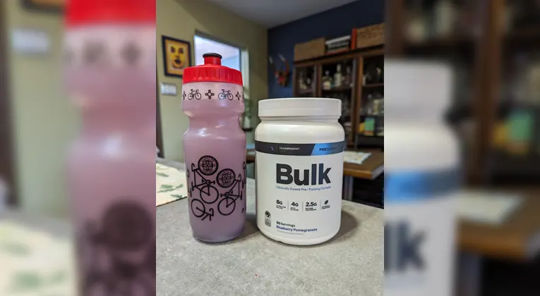A shaker bottle contains blueberry flavor of transparent labs bulk with product bottle.